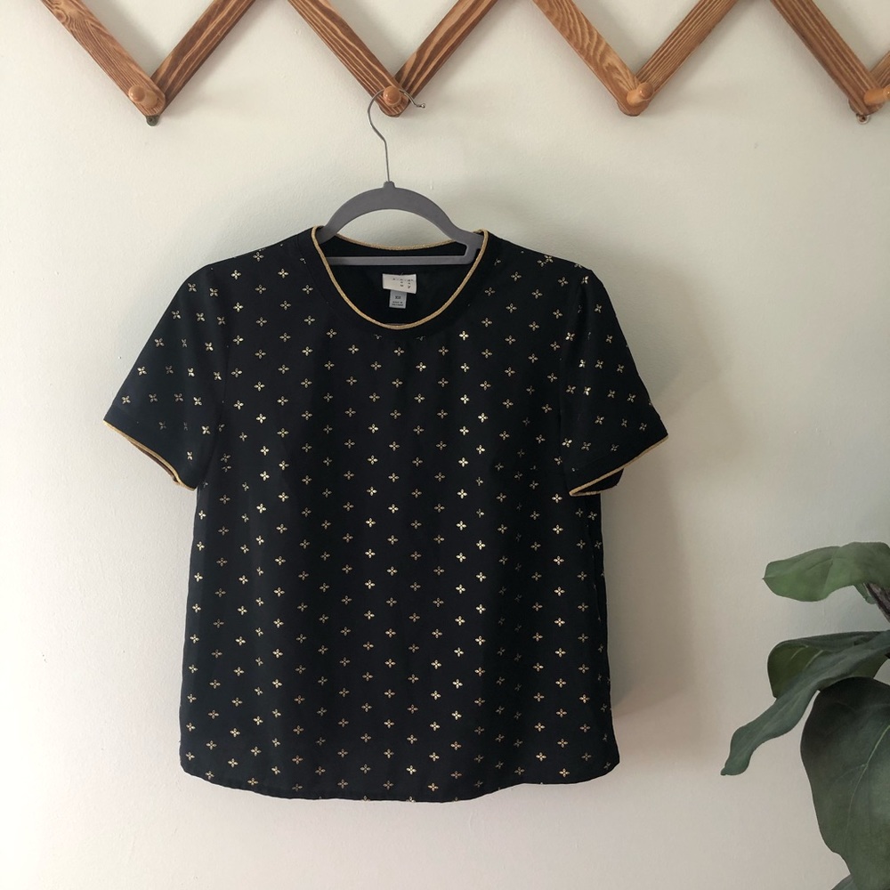 a new day, black and gold short sleeve top.